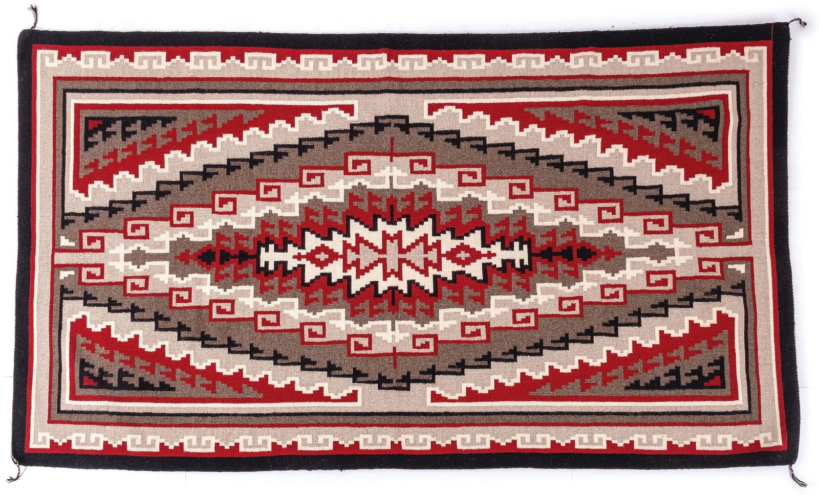 NAVAJO (DINÉ) LARGE RUG KLAGETOH: Contemporary. With an elongated central stepped diamond pattern encased by four elongated triangles that fill each corner and extend to the center, bordered by bands at the top and bottom and "T" elem