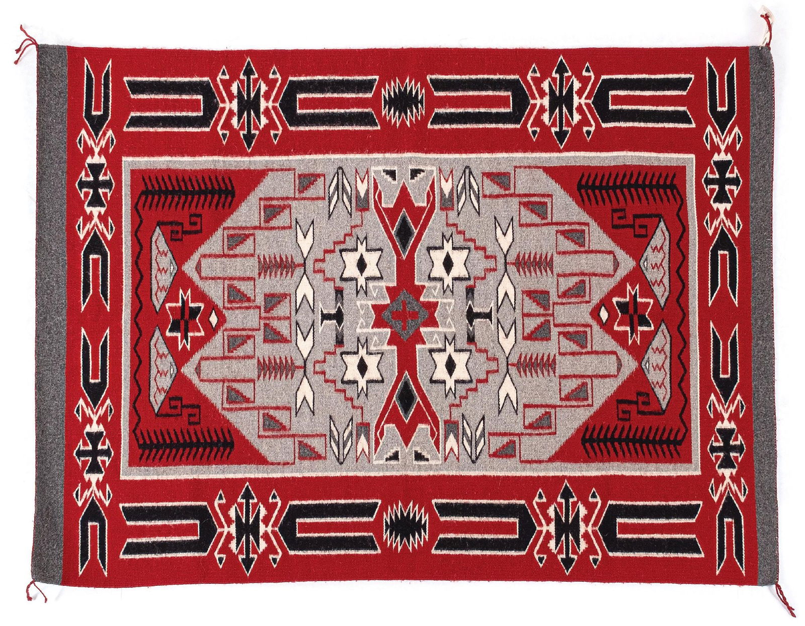 NAVAJO (DINÉ) WEAVING TEEC NOS POS: Contemporary. With a central cross encased by a complicated central field full of geometric patterns, surrounded by a wide traditional Teec Nos Pos border and similar grey bands on each end. Dimension