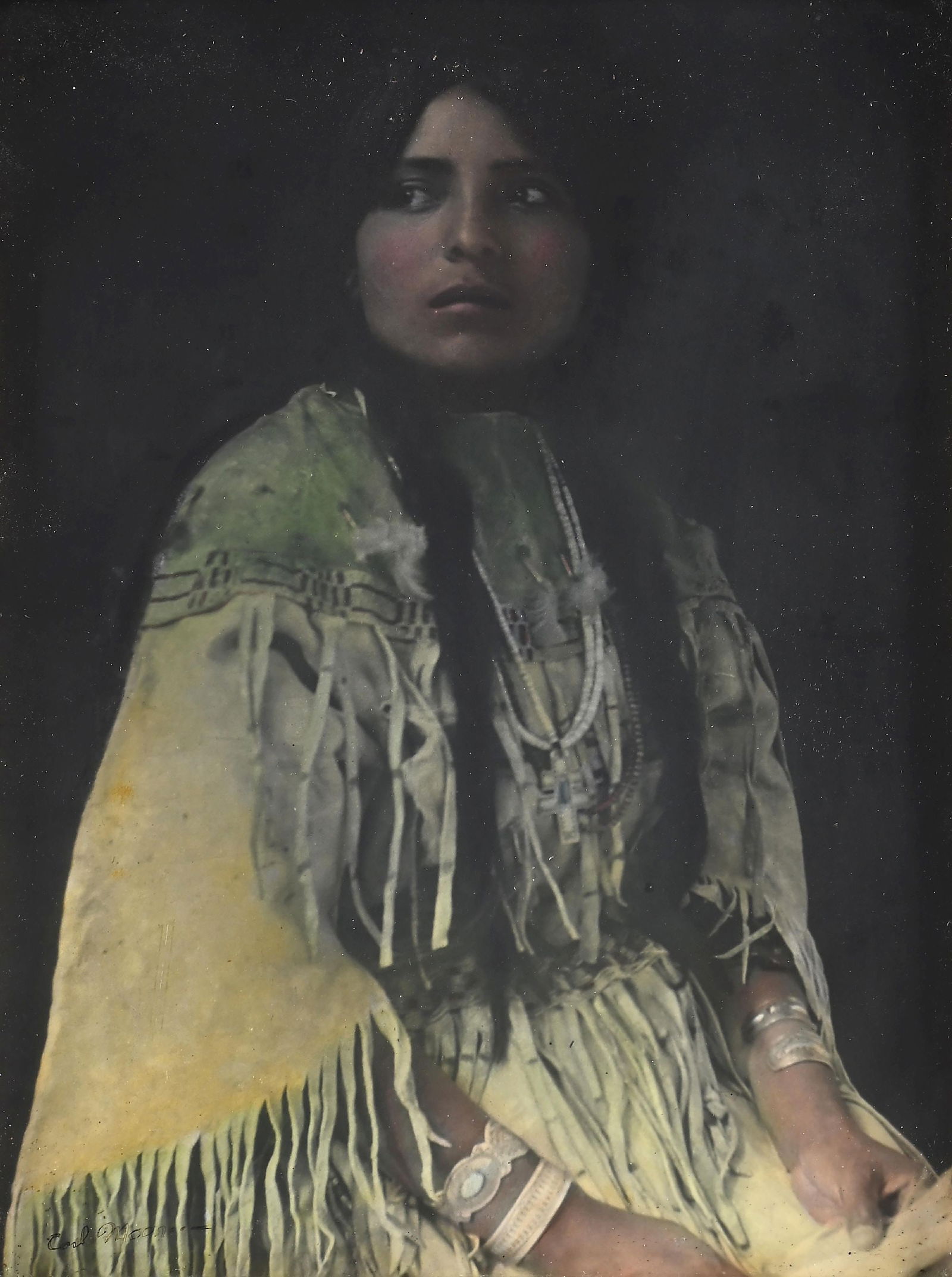 CARL MOON (AMERICAN, 1878-1948): A Warrior Bride Taos, c. 1914. Abida view #2 hand-tinted color photograph signed "Carl Moon" lower left corner sight: 16" x 12" framed: 24-1/4" x 20-1/4" in original ornate gold tone wood frame Dimens