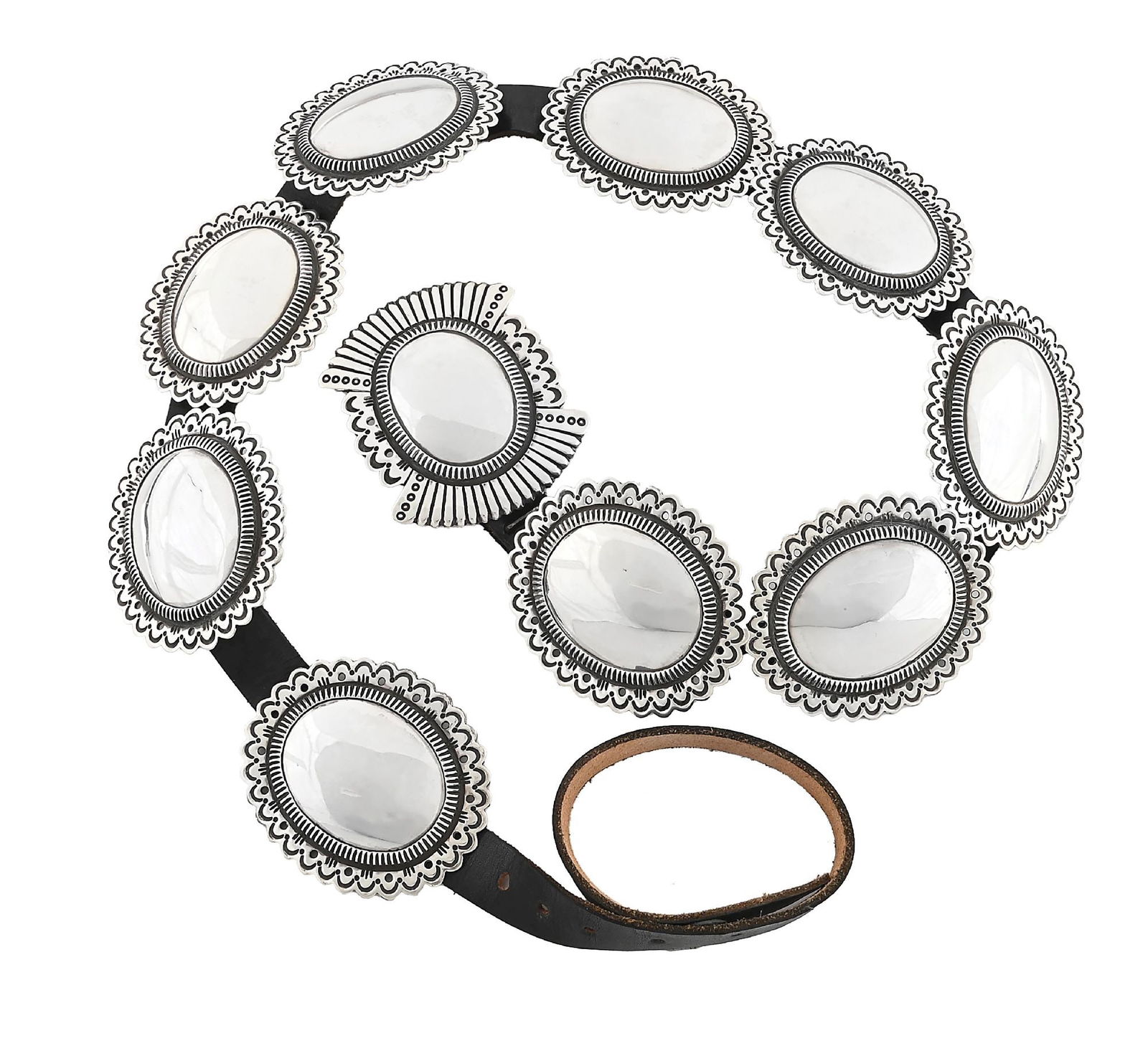 STERLING SILVER & LEATHER CONCHO BELT (COCHITI) BY CIPPY CRAZY HORSE B. 1946: Contemporary. Sterling silver and leather concho belt. Marked "Sterling" and signed with "N' on buckle. Conchos measure approximately 3" x 2-1/2" each. Buckle measures 3-1/4" x 2-1/2". Overall length