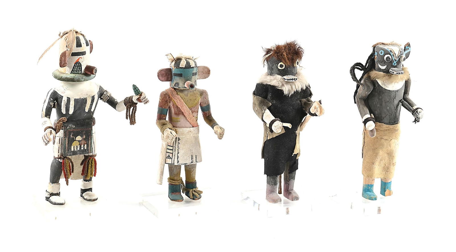LOT OF 4: HOPI (HOPISINOM) KACHINAS: (Katsina). Circa mid-20th century. Each on an acrylic glass stand. Dimensions: Largest: 4 - 1/2" x 4 - 1/2" x 13".