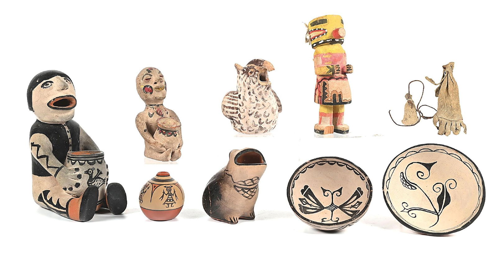 LOT OF 9: SOUTHWEST NATIVE AMERICAN ITEMS: Including a Cochiti Story Teller, a Tesuque Rain God, a Zuni Owl, a Hopi Kachina, two Cochiti pottery bowls, a Cochiti pottery frog, and a Santa Clara miniature Olla by Margaret and Luther. Condition: