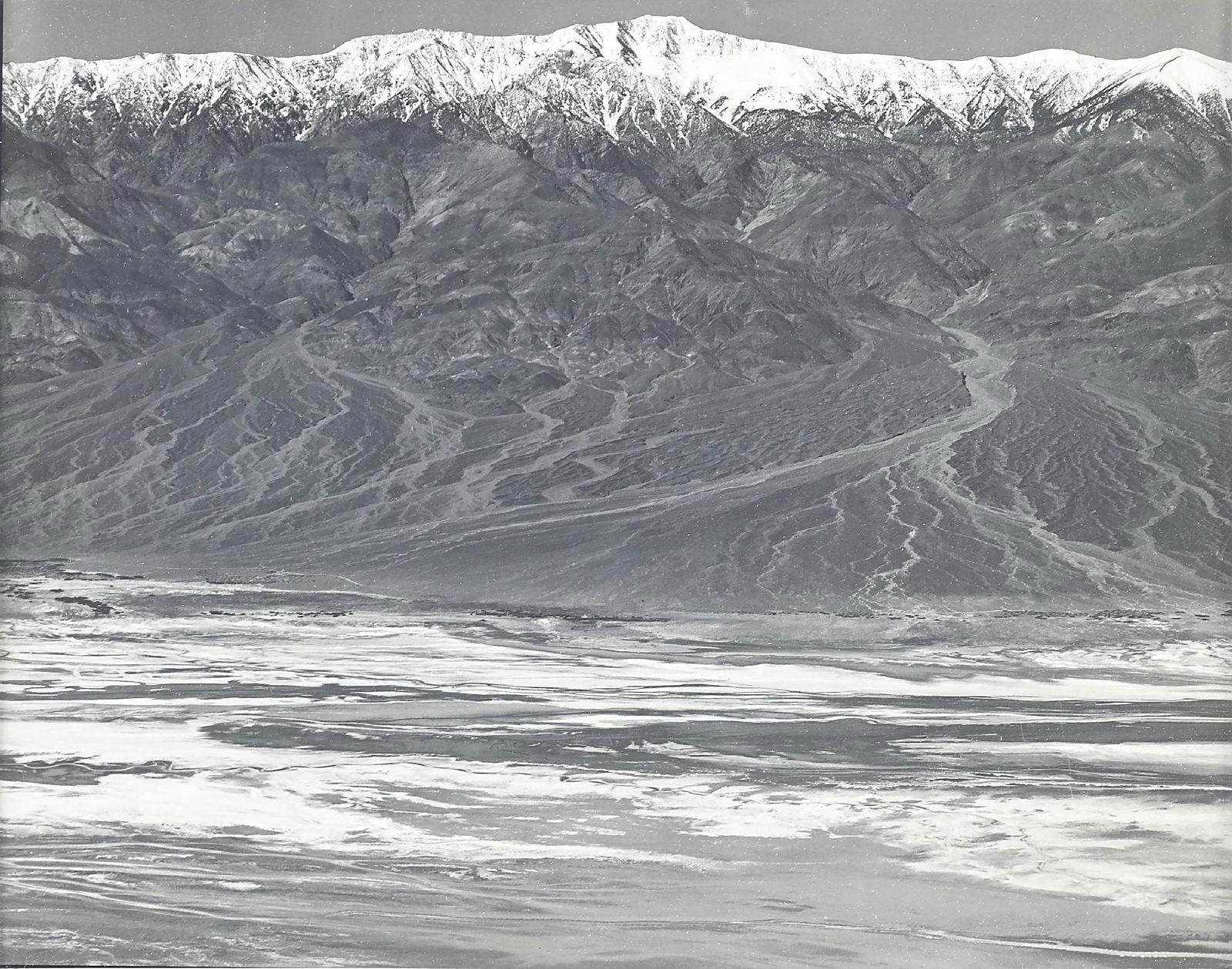 EDWARD WESTON (AMERICAN, 1886-1958): Dante's View, Death Valley, 1938 The title Death Valley , Edward Weston" and "dv-dv-4g" written in pencil on reverse gelatin silver print image: 7-1/2" x 9-1/4" framed: 13-1/2" x 15-5/8" Provenance: A