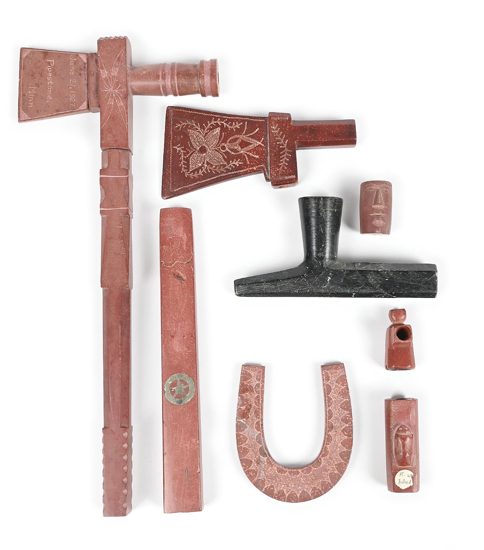 LOT 8: CATLINITE ITEMS: Catlinite pipe with catlinite stem with floral patterns engraved, dated June 21, 1927, catlinite pipe bowl with engraved floral pattern, black catlinite pipe bowl, catlinite pipe stem with lead inlay