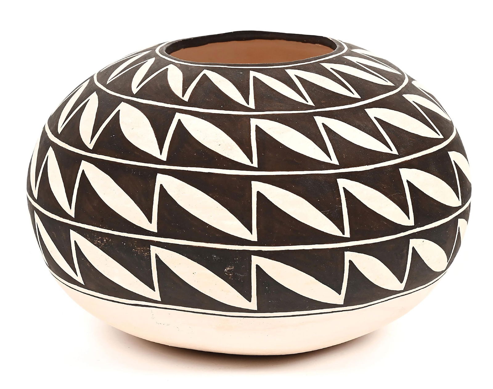 ACOMA (ÁAK’U) POTTERY OLLA: Contemporary. Signed on the base "Drew Lewis / Acoma, N.M.". A large seed jar form, covered in four repeating bands of curvilinear design. Dimensions: 9" Dia. x 6-1/2" T. Dimensions: 9" Dia. x 6 1/2"
