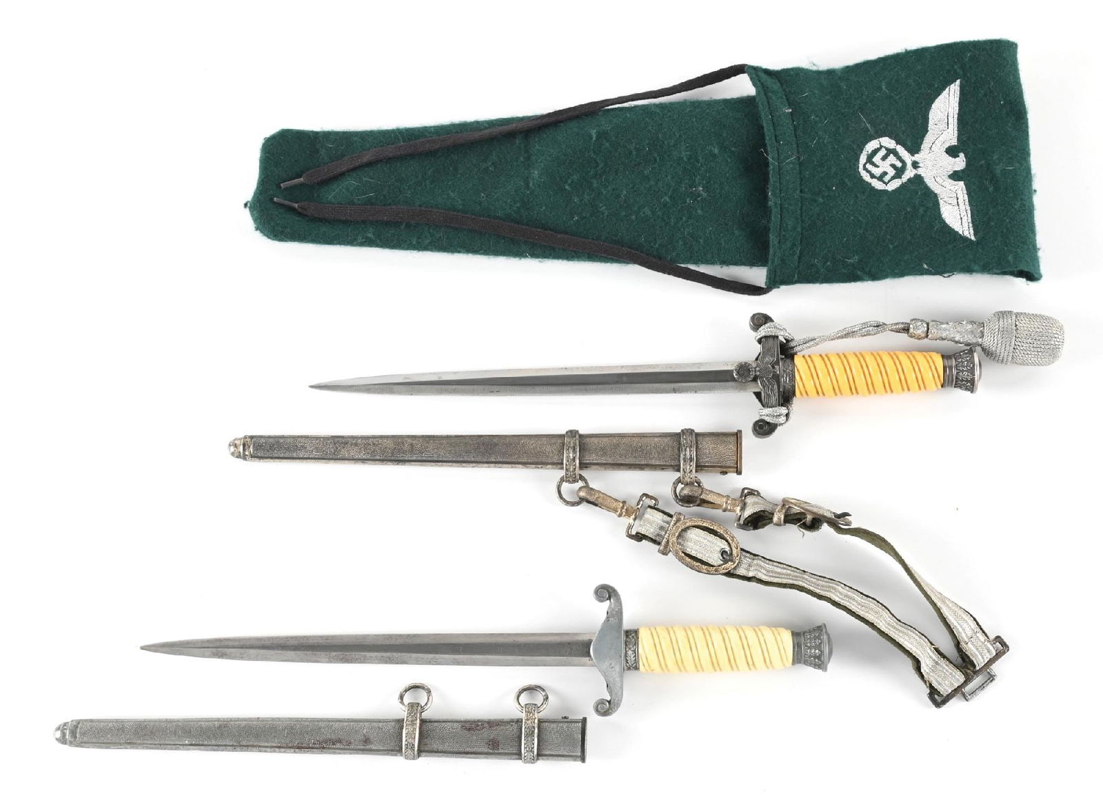 LOT OF 2: GERMAN WWII HEER DAGGERS.: Lot consists of (A) Heer dagger with a "WKC / SOLINGEN" marked blade. Visible cross graining, light runner marks, and scattered blemishes are exhibited on the blade. Nickel silver plated fittings exhi