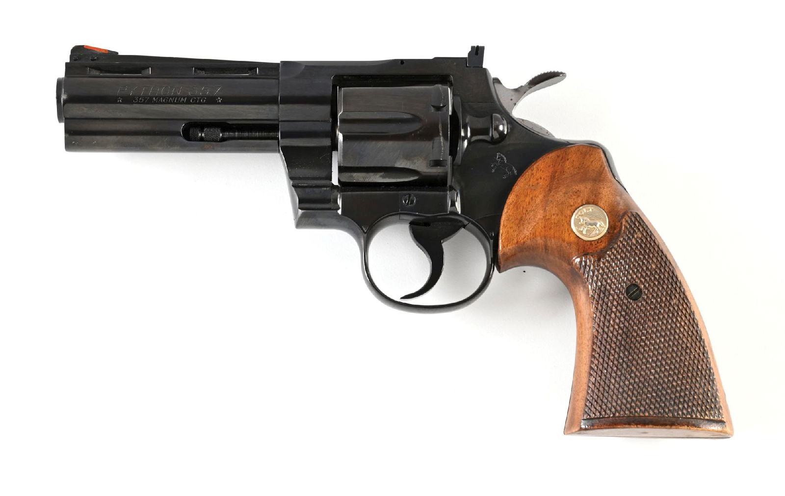 (C) COLT PYTHON DOUBLE ACTION REVOLVER (1969).: Circa 1969 per serial number. Classic configuration with dual pinned serrated slope red insert front sight, adjustable square notch rear sight, and typical Colt legends throughout. Walnut grips with g