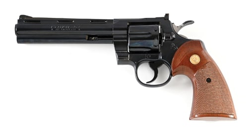 (C) COLT PYTHON DOUBLE ACTION REVOLVER (1974).