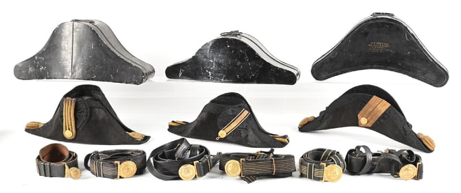 LOT OF 9: US NAVY CHAPEAUS DE BRAS AND BELTS.