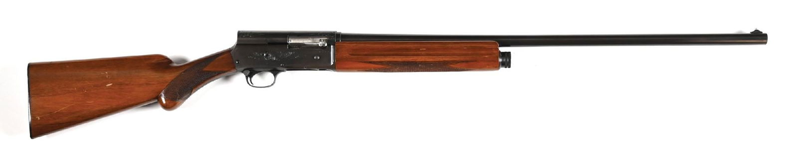 (C) BELGIAN BROWNING A5 SEMI-AUTOMATIC 16 GAUGE SHOTGUN.: This example dates to 1952. Features a plain barrel with bead-on-base front sight, blue finish, engraved frame, checkered walnut stock with round knob, FN Browning black buttplate, and matching forear