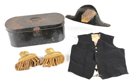 CASED SET OF US NAVY LIEUTENANT EPAULETTES, HAT, AND VEST.