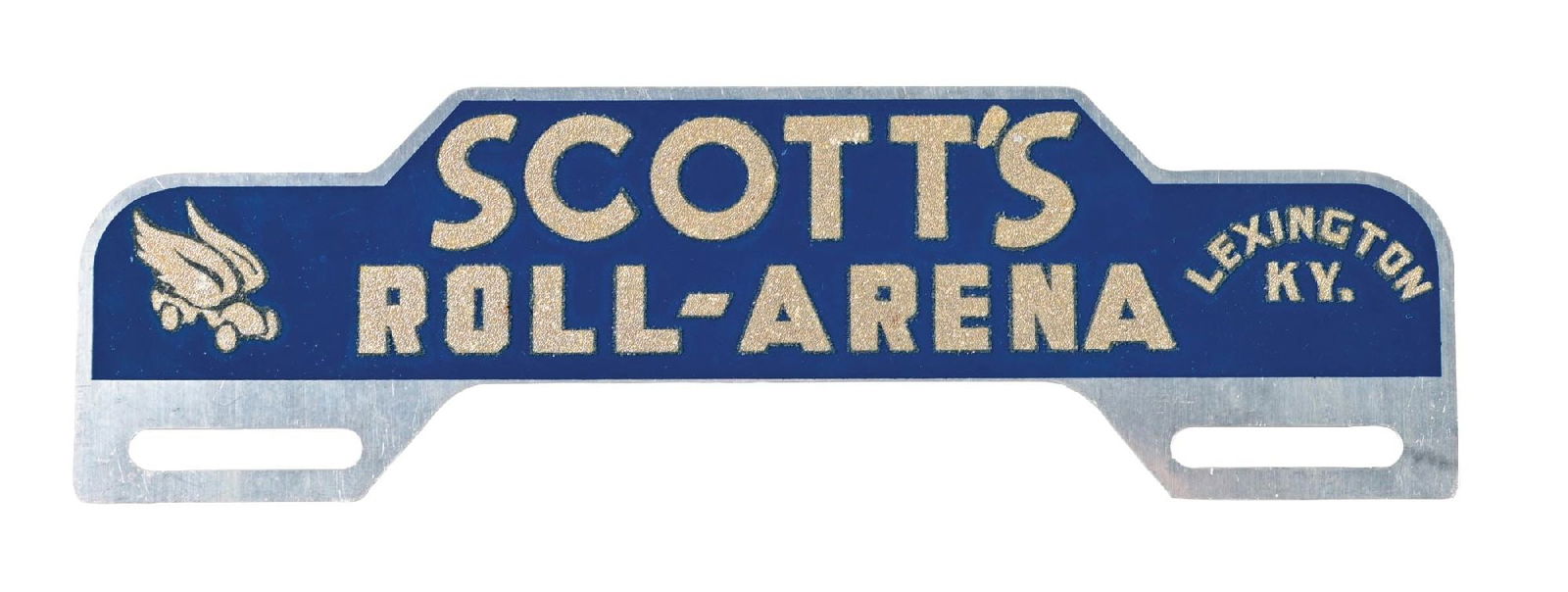 SCOTT'S ROLL-ARENA TIN LICENSE PLATE TOPPER: SST. C. 1950s. CONDITION: Excellent color and gloss, showing sand painted graphic and script surface. Minor areas of light staining with minimal surface wear from storage. An outstanding and most like
