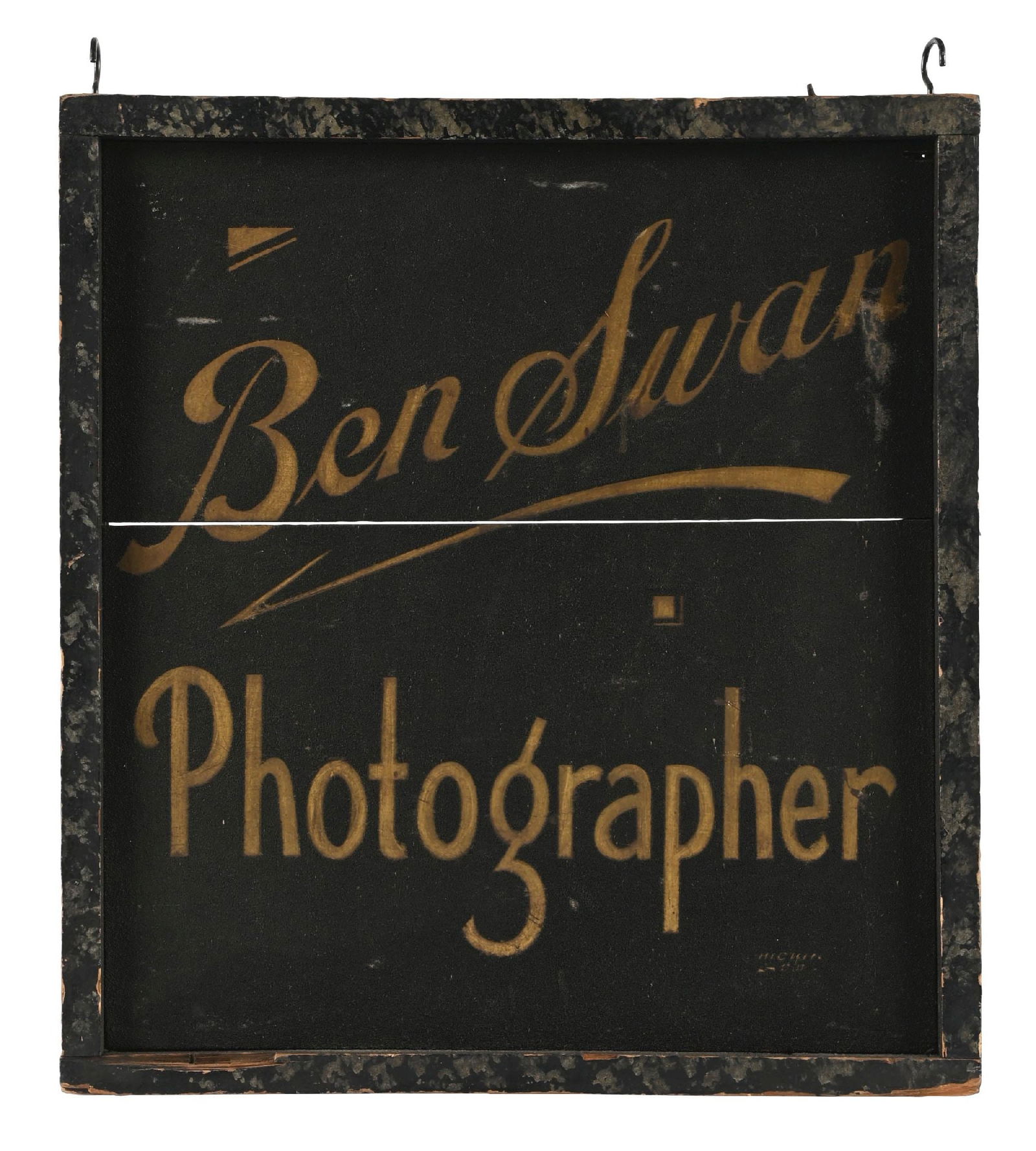 BEN SWAN PHOTOGRAPHER SAND PAINTED WOOD SIGN W/ ORIGINAL WOODEN FRAME: Double-Sided Hand-Painted Wood. C. 1910s. Maker marked "Hickin". CONDITION: Excellent original surface throughout each side, showing sand painted black surface with gold lettering. Minimal areas of li