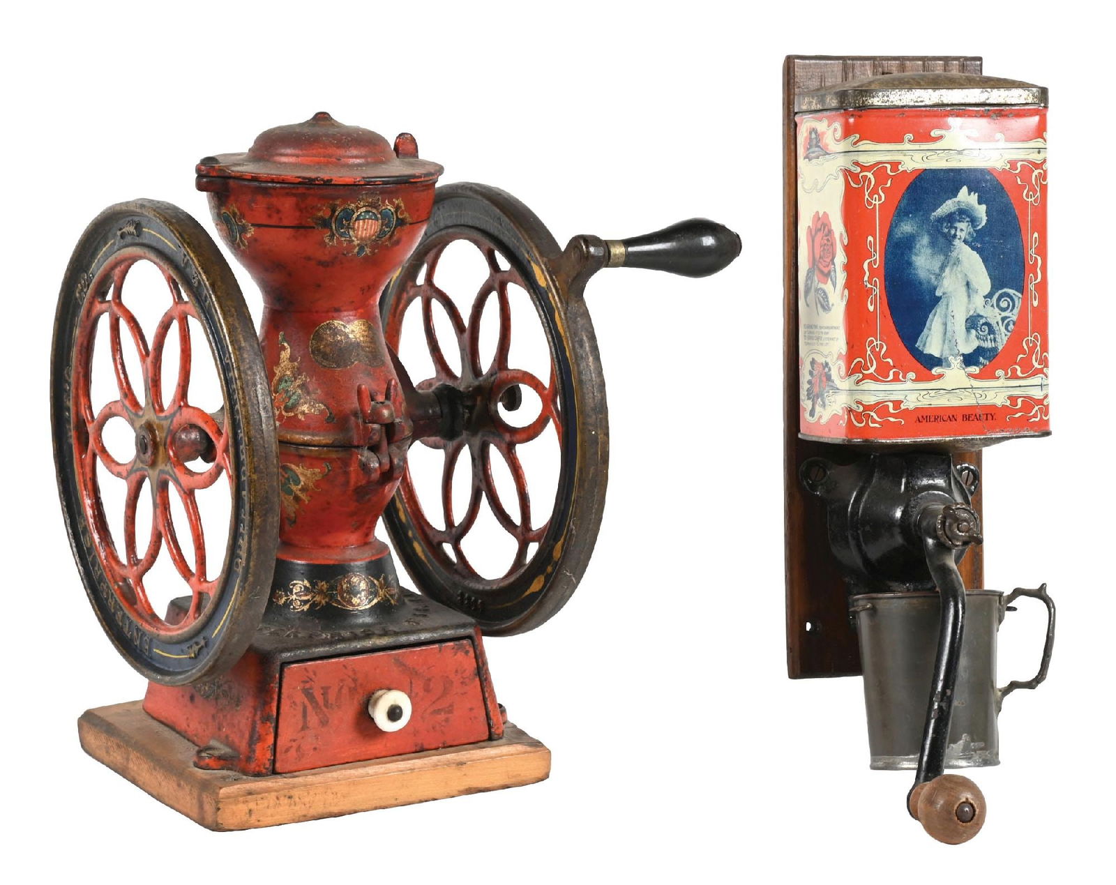 PAIR OF COUNTRY STORE COFFEE GRINDERS: CONDITION: (A) A wall mount American Beauty Coffee Grinder with a replaced catch cup. It shows an original tin dispenser with light wear and some areas of paint loss. It has an original wood backing.
