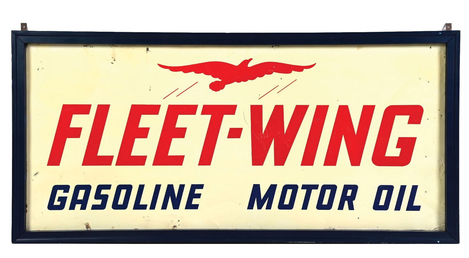 FLEET WING GASOLINE & MOTOR OIL TIN SIGN WITH WOOD FRAME: SST. CONDITION: Bright & glossy showing clean script and graphic, with minor areas of wear and surface scratching in the inner field. Outer field showing some shallow dents as well as some added nail