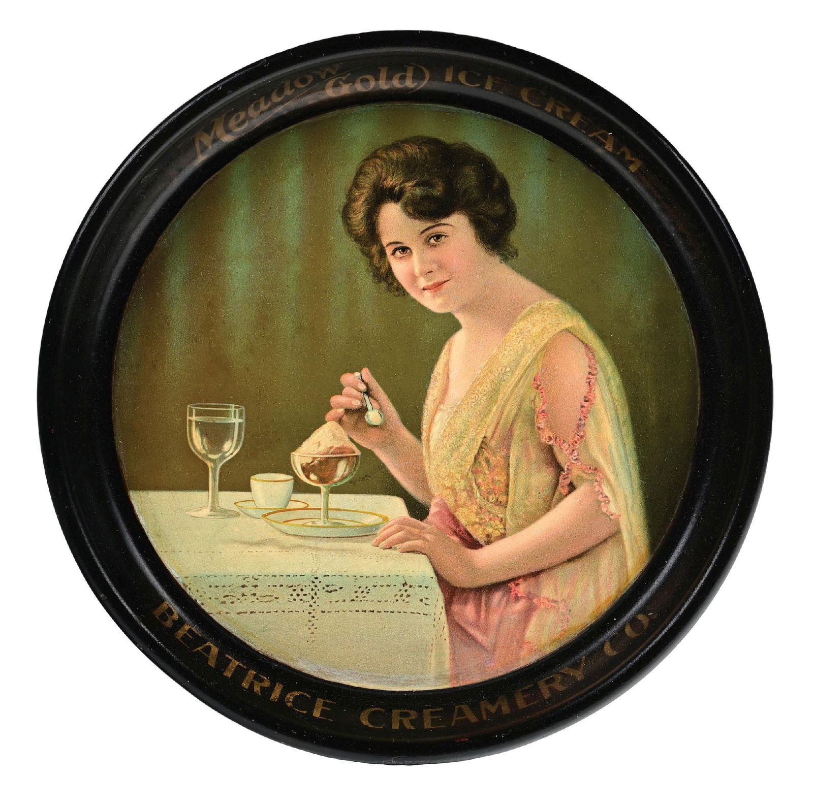 MEADOW GOLD ICE CREAM SERVING TRAY: Made by the Beatrice Creamery Co., depicting a young lady enjoying her ice cream. CONDITION: Showing light foxing to the main field, with an area scuff mark at the extreme middle bottom. Light edge we