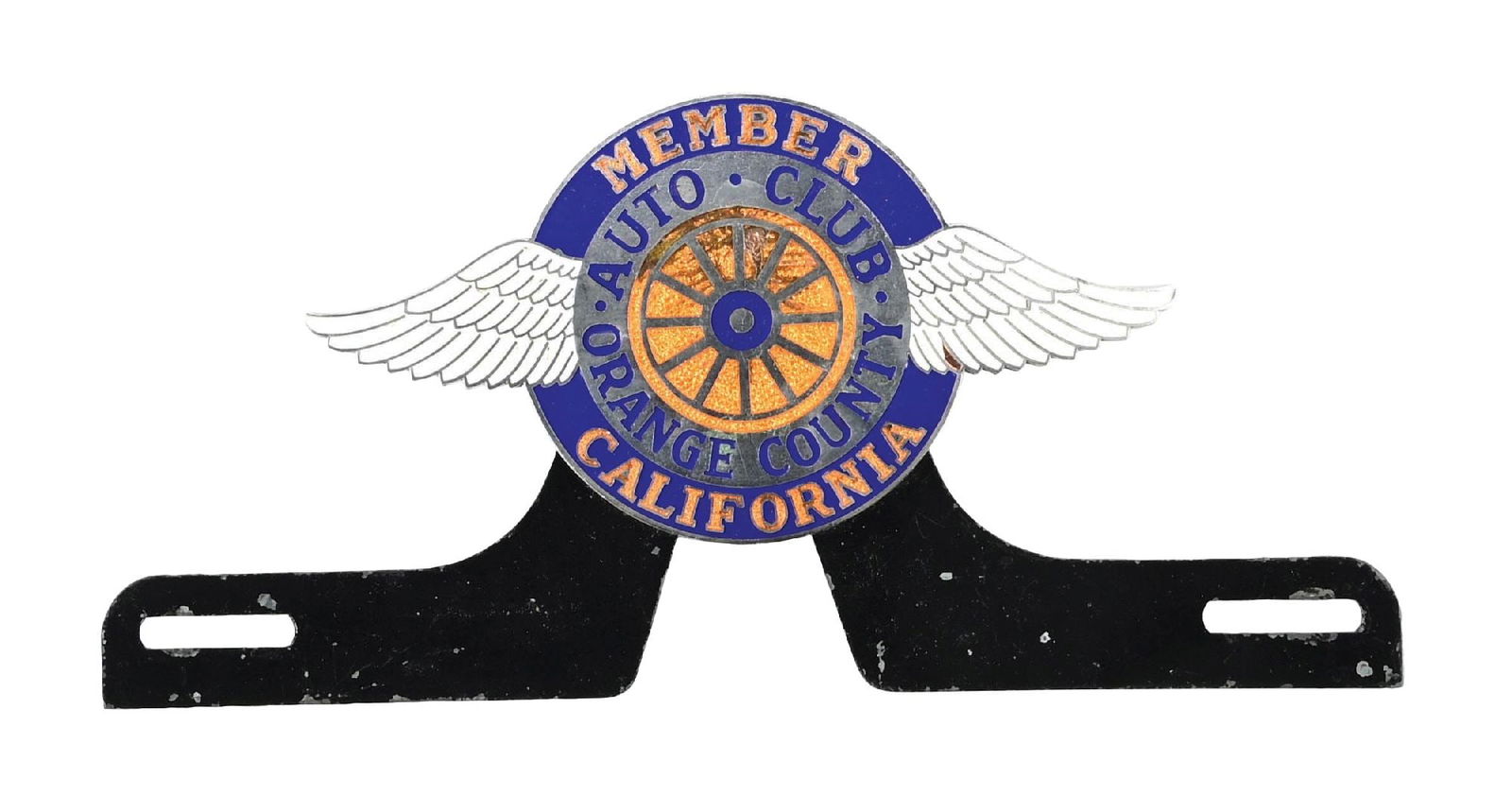 ORANGE COUNTY CALIFORNIA AUTO CLUB CLOISONNE LICENSE PLATE TOPPER: C. 1930s. CONDITION: Excellent color and shine with limited wear in the field, showing some light nicks as well as some minor stain marks. Wings are in excellent condition with light wear on the mount
