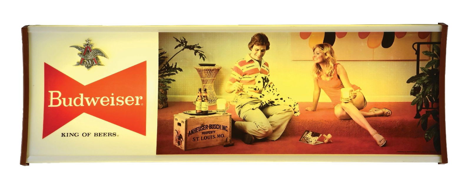 BUDWEISER KING OF BEERS COUPLE W/ DALMATION LIGHT-UP SIGN: C. 1970s, Anheuser-Busch, St. Louis, Missouri. Difficult to find sign in this condition. Neat scene from the 1970s with couple playing with Dalmation dog on the floor. CONDITION: Clean overall, with