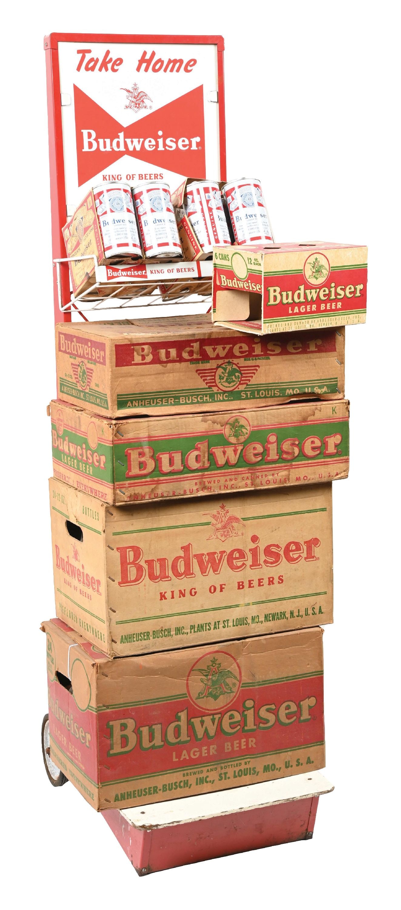 BUDWEISER KING OF BEERS DISTRIBUTOR DISPLAY SIGN ON WHEELS: C. 1970s, Anheuser-Busch, St. Louis, Missouri. Difficult to find display sign. Includes seven Budweiser cases, two with bottles, two have six-pack cans. CONDITION: Clean overall with some light wear,