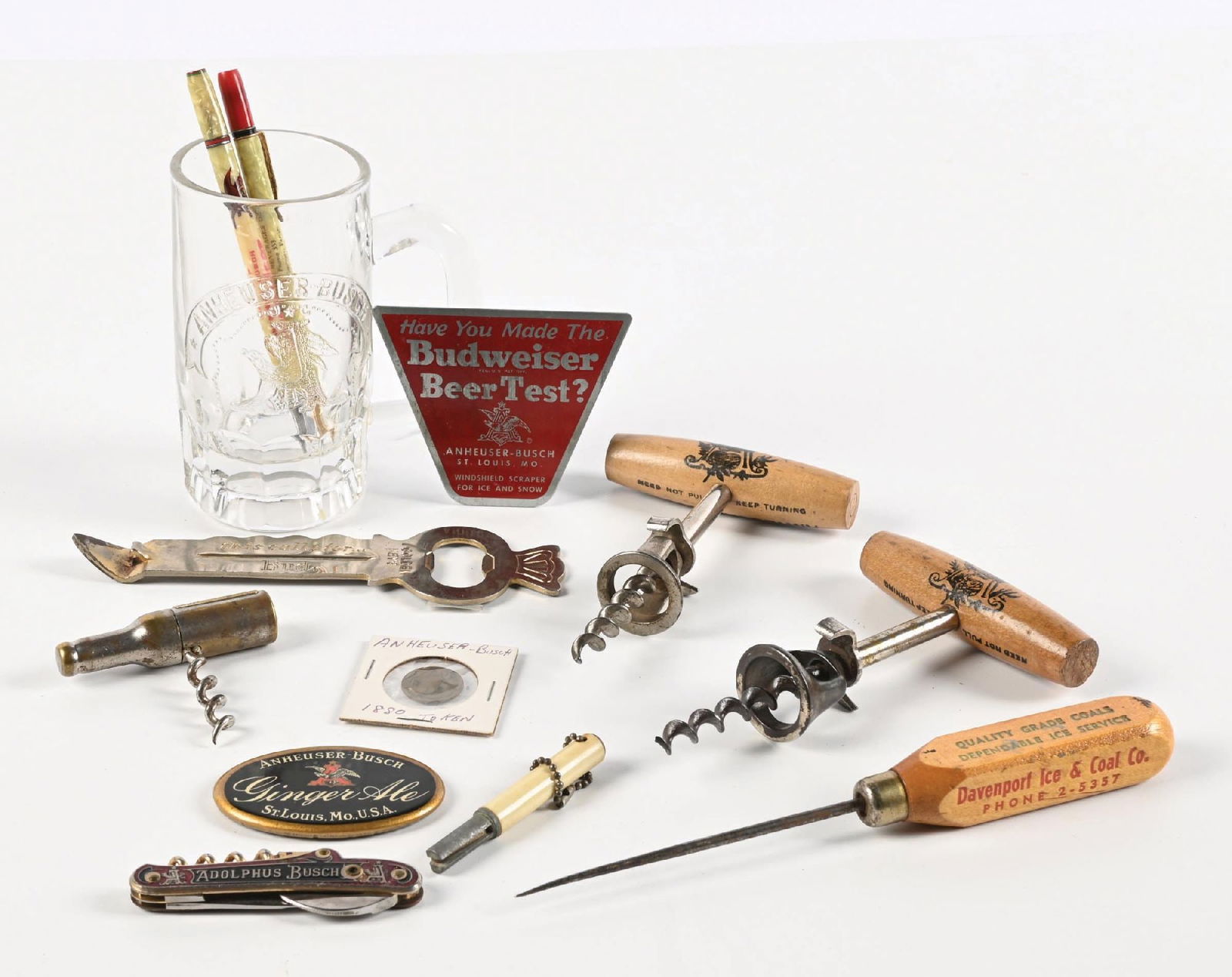 MISCELLANEOUS LOT OF ANHEUSER-BUSCH BUDWEISER BEER ITEMS: Anheuser-Busch, St. Louis, Missouri. CONDITION: Includes early mug, pre-prohibition Adolphus Busch stanhope pocketknife with missing image. Other items are solid overall, with some wear. Condition: