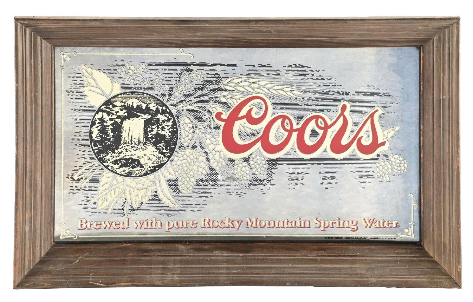 COORS BEER FRAMED GLASS BAR DISPLAY SIGN: Single-sided glass with original wood frame. C. 1980. CONDITION: Very good throughout, showing bright color to the glass with minimal oxidation. Wooden frame shows general wear, but free of any heavy