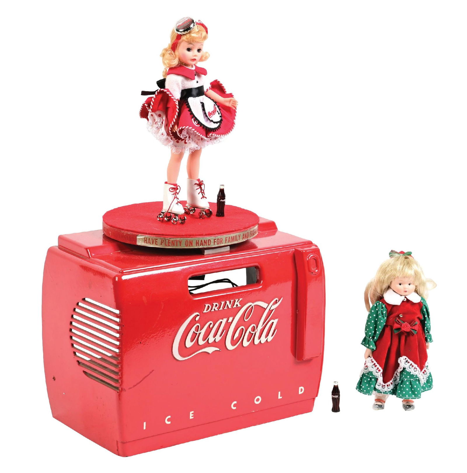 COCA-COLA COOLER MUSIC BOX W/ MOTION TOP: CONDITION: Bakelite music box showing no breaks or repairs, with a scuff mark on the left-hand edge of the front, showing the original carousel with two original dolls that were mounted on the top,
