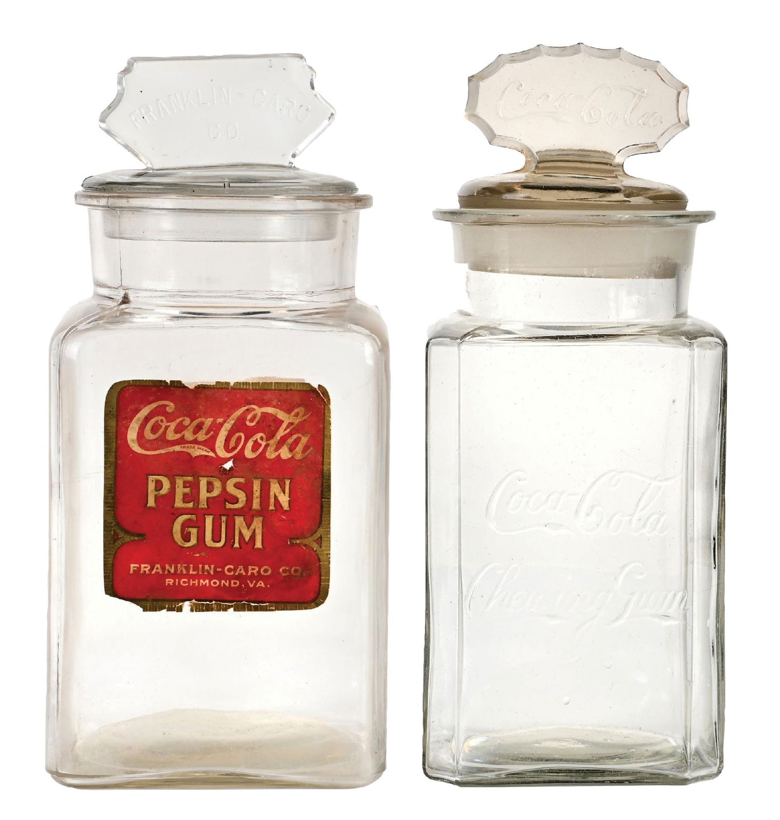 PAIR OF COCA-COLA PEPSIN GUM DISPLAY JARS: CONDITION: (A) A Coca-Cola chewing gum jar, with an embossed front, ground-stopper top, and fluted marquee. The ground lid does not quite fit the jar. No breaks or cracks. (8.5). (B) A Franklin Caro
