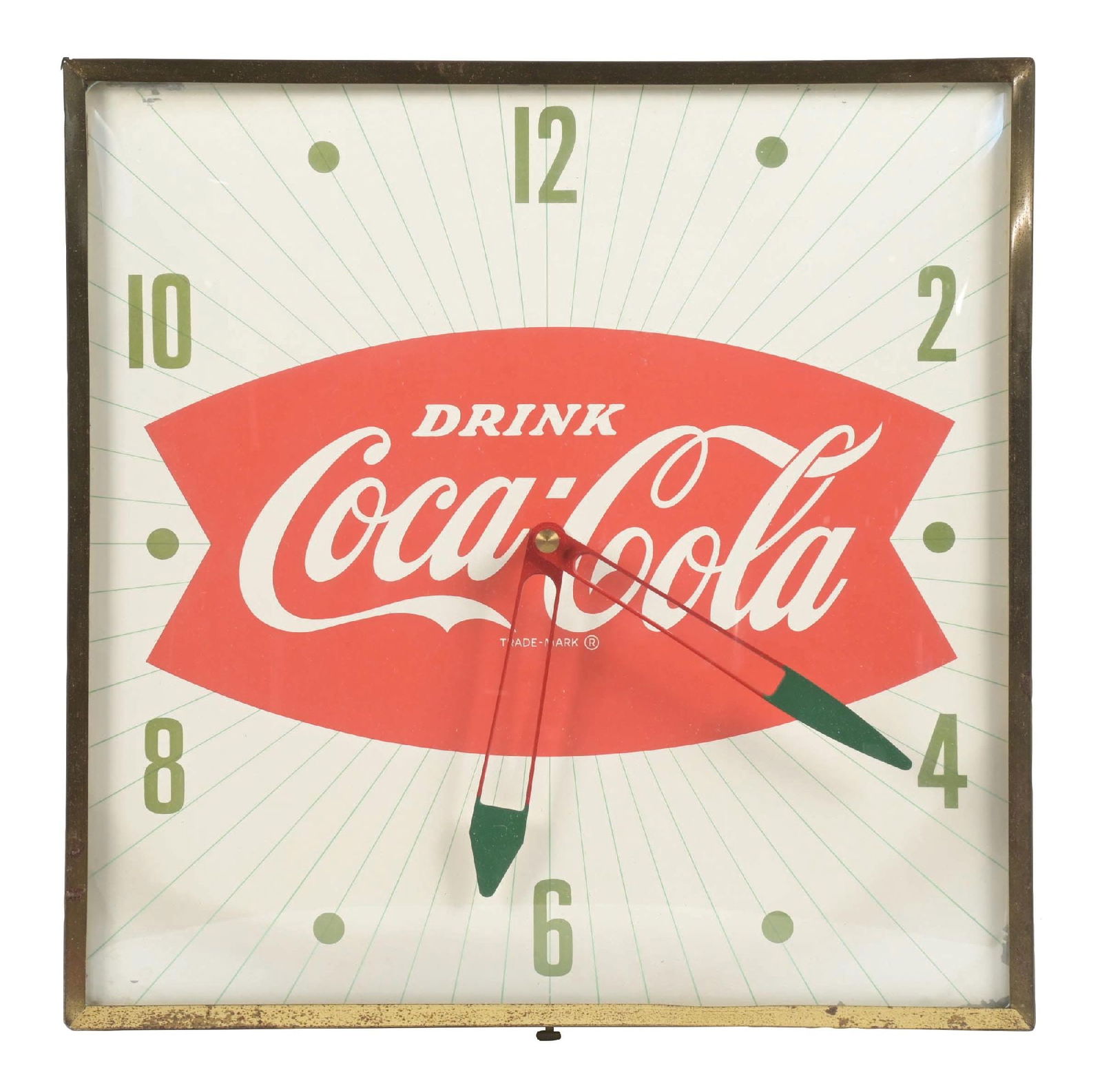COCA-COLA FISHTAIL CLOCK: A nice example of this c. 1960s light-up clock from Coca-Cola featuring the iconic script logo and fishtail design. CONDITION: The face of this clock shows very light fading to the interior field.