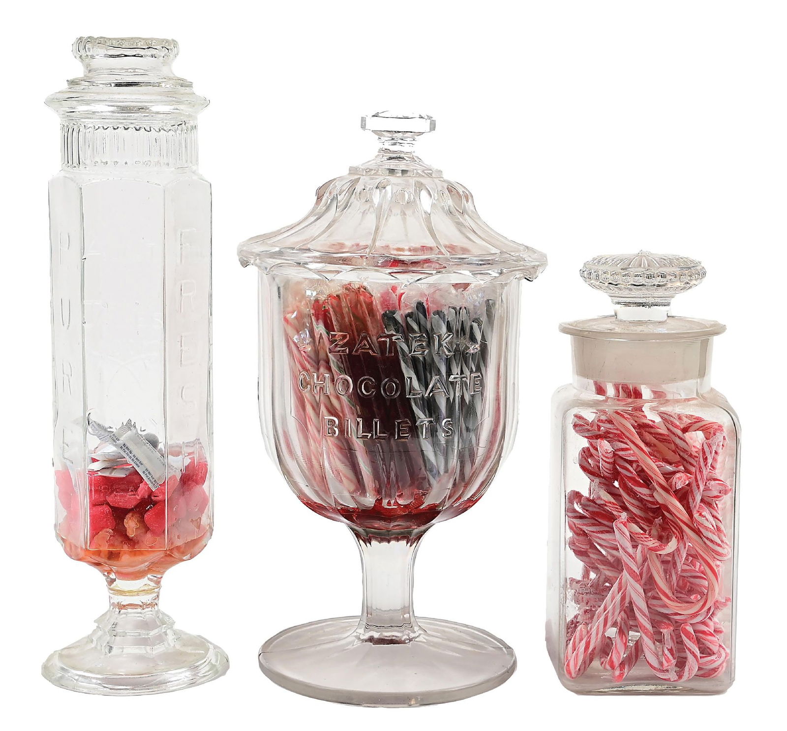 COLLECTION OF 3: COUNTRY STORE CANDY JARS: CONDITION: (A) A ground stopper Dakota lid candy jar. It shows light chipping around the rim, but no cracks or breaks. (B) A 20-quart True Measure candy jar. It shows light chipping around the rim, bu