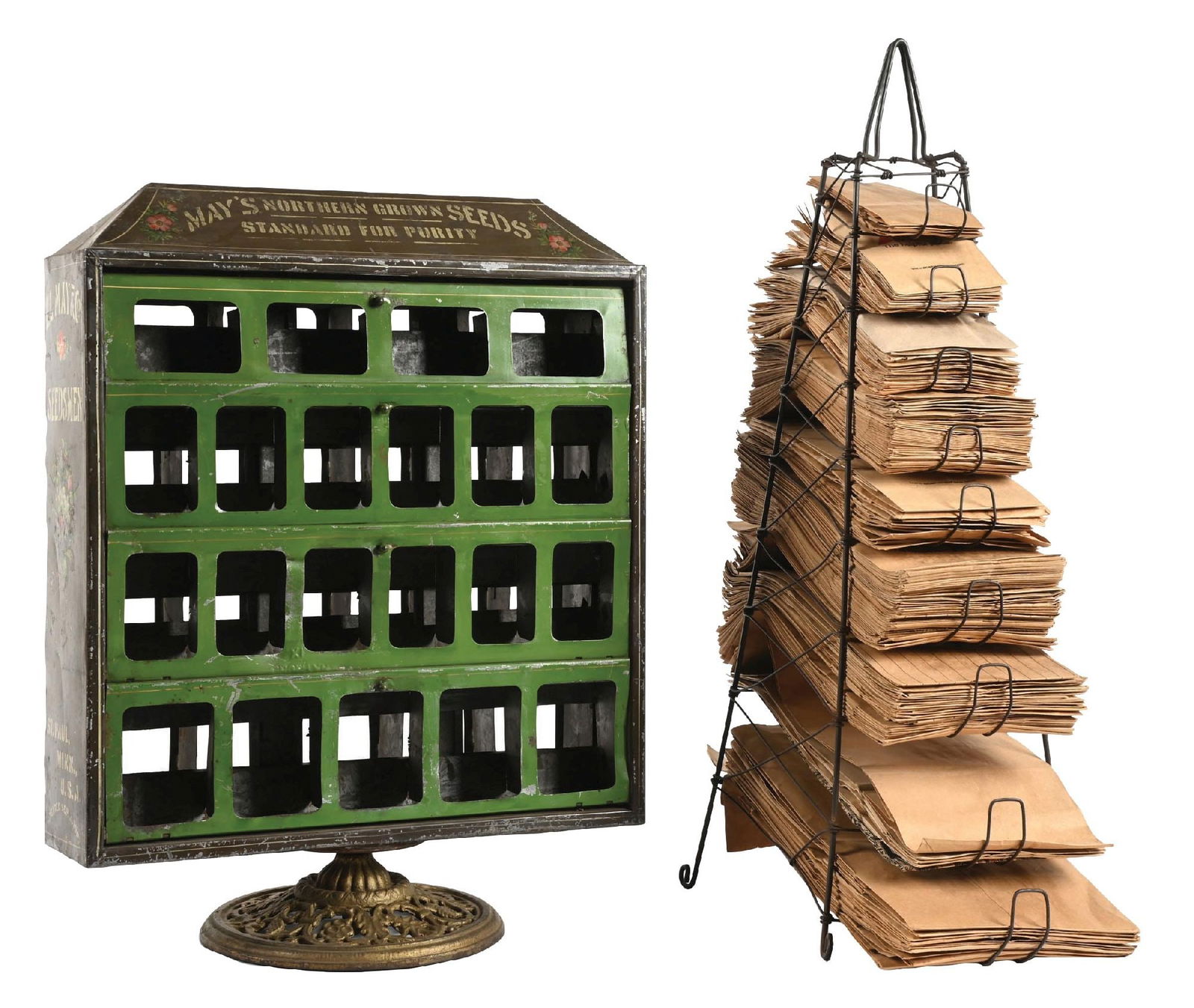 PAIR OF COUNTRY STORE DISPLAY PIECES: CONDITION: (A) A Maize Northern Grown seed display. Tin construction, with graphics on the edge and top. It has an original revolving base, showing some areas of paint loss, scuffs, scrapes, and some