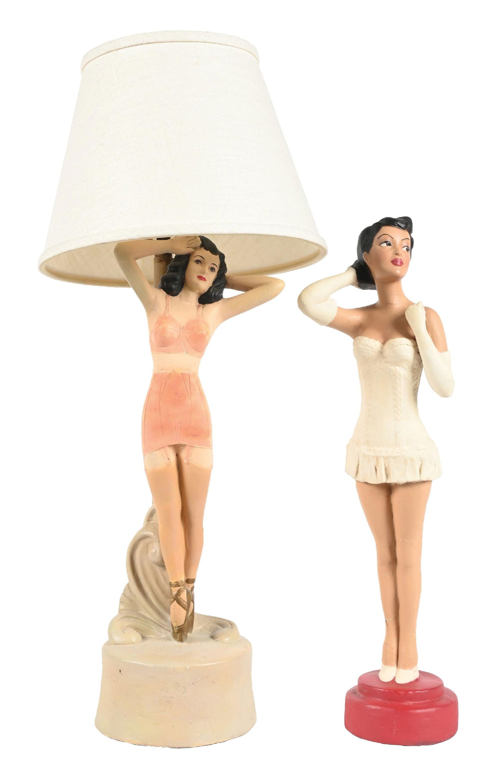 PAIR OF FIGURATIVE LINGERIE DISPLAYS: CONDITION: (A) A lingerie display lamp. Ceramic construction, with all original hardware and cord. It has an added shade. It shows light wear, no breaks or cracks, and all original paint. (8.5). (B)