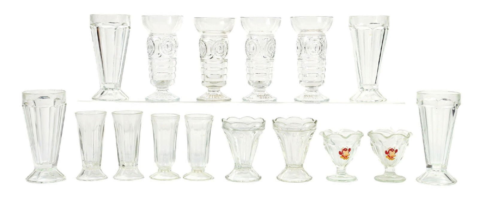 LARGE ASSORTMENT OF SODA FOUNTAIN ICE CREAM JARS: CONDITION: Shows a wide assortment soda fountain ice cream and milkshake glasses and jars. There are no significant chips or cracks to the rim, and no repairs to any of the glass. Condition: (Very Goo