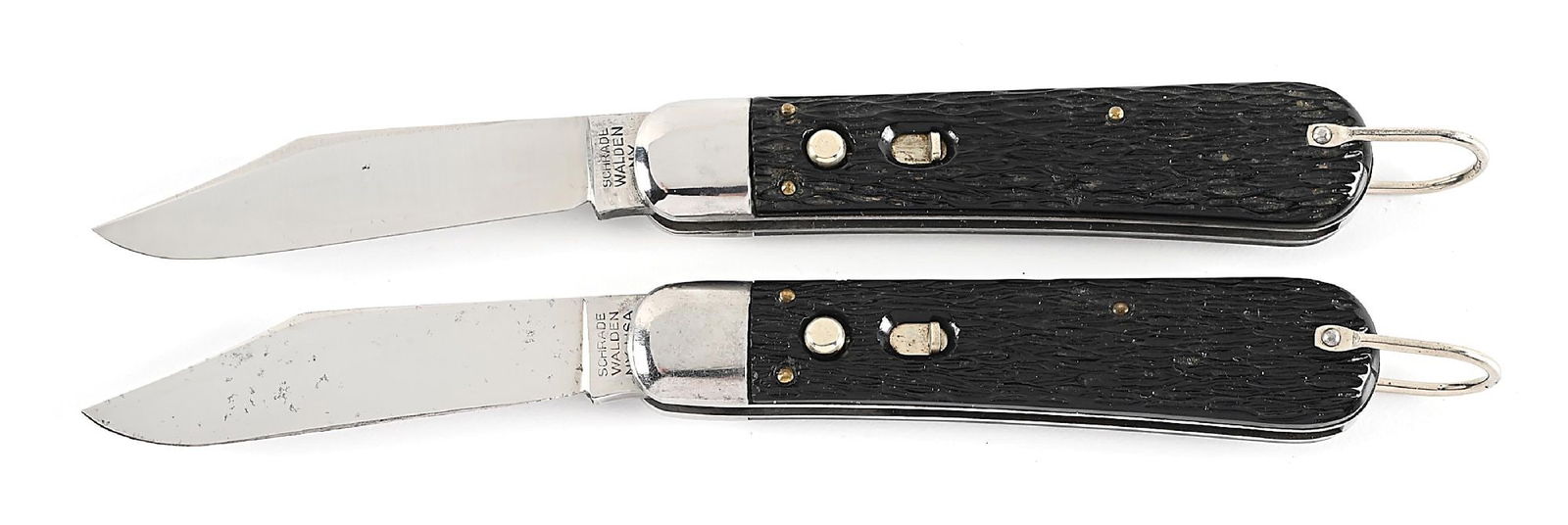LOT OF 2: SCHRADE M2 PARATROOPER SWITCHBLADE KNIVES.: Lot consists of: (A) C. Post 1948 Schrade M2 Paratrooper switchblade knife. Appears unused and unsharpened. The blade is tang stamped “SCHRADE WALDEN, NY” on obverse. Jigged black peach se
