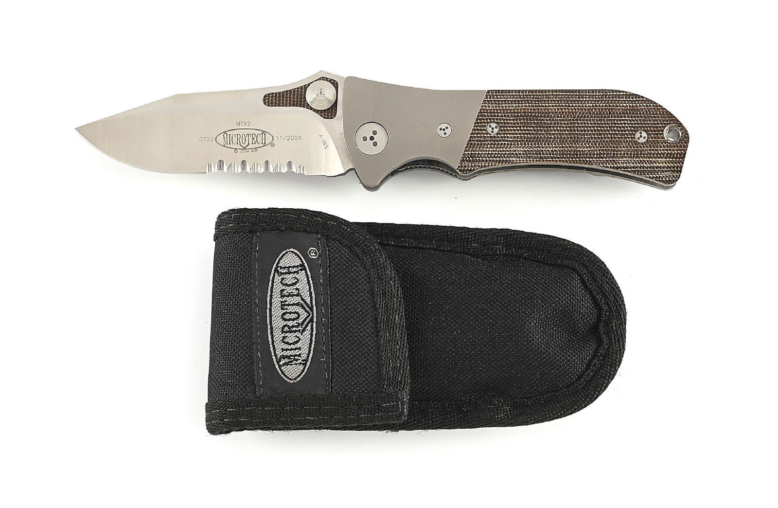 MICROTECH MTX-2 MANUAL ACTION GREEN CANVAS MICARTA HANDLES.: Appears unused and unsharpened. Blade is marked on obverse “MTZ2 0122 MICROTECH 11/2004 S30V”. S30V blade steel. Partially serrated blade. Vero Beach, Fl made knife. Titanium liners and