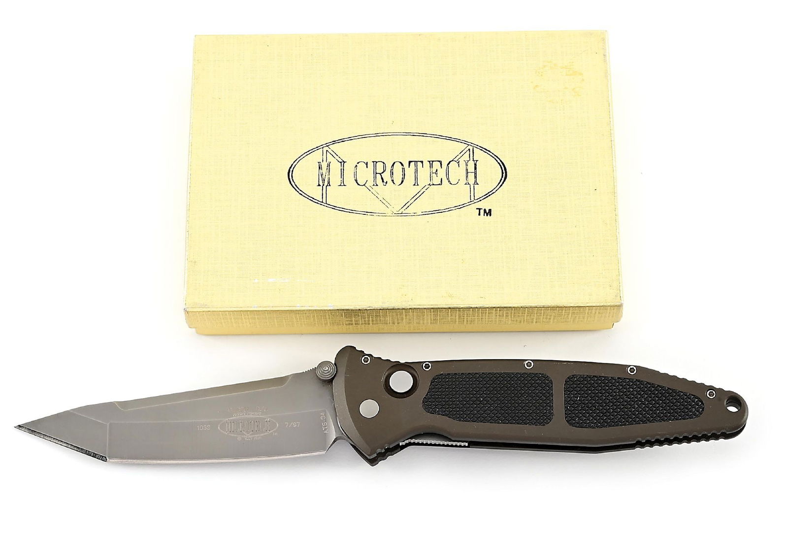 BOXED MICROTECH SOCOM DOUBLE ACTION.: Microtech SOCOM D/A that features an ATS-34 tanto blade marked "SOCOM D/A" with Microtech logo and "PATENT PENDING / 1997 ALM". Numbered "1053" and dated "7/97". Aluminum frame with non-slip inserts