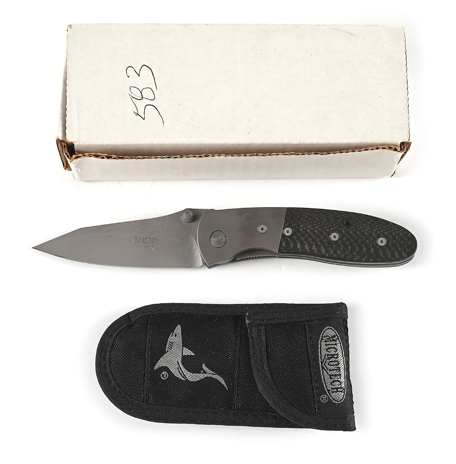 BOXED MICROTECH LIGHTFOOT.: Microtech Lightfoot LCC D/A features a bead blasted 154-CM plain blade marked "LIGHTFOOT L.C.C. D/A" with Microtech logo. Numbered "2596" and dated "12/2000". Bead blasted titanium bolsters with