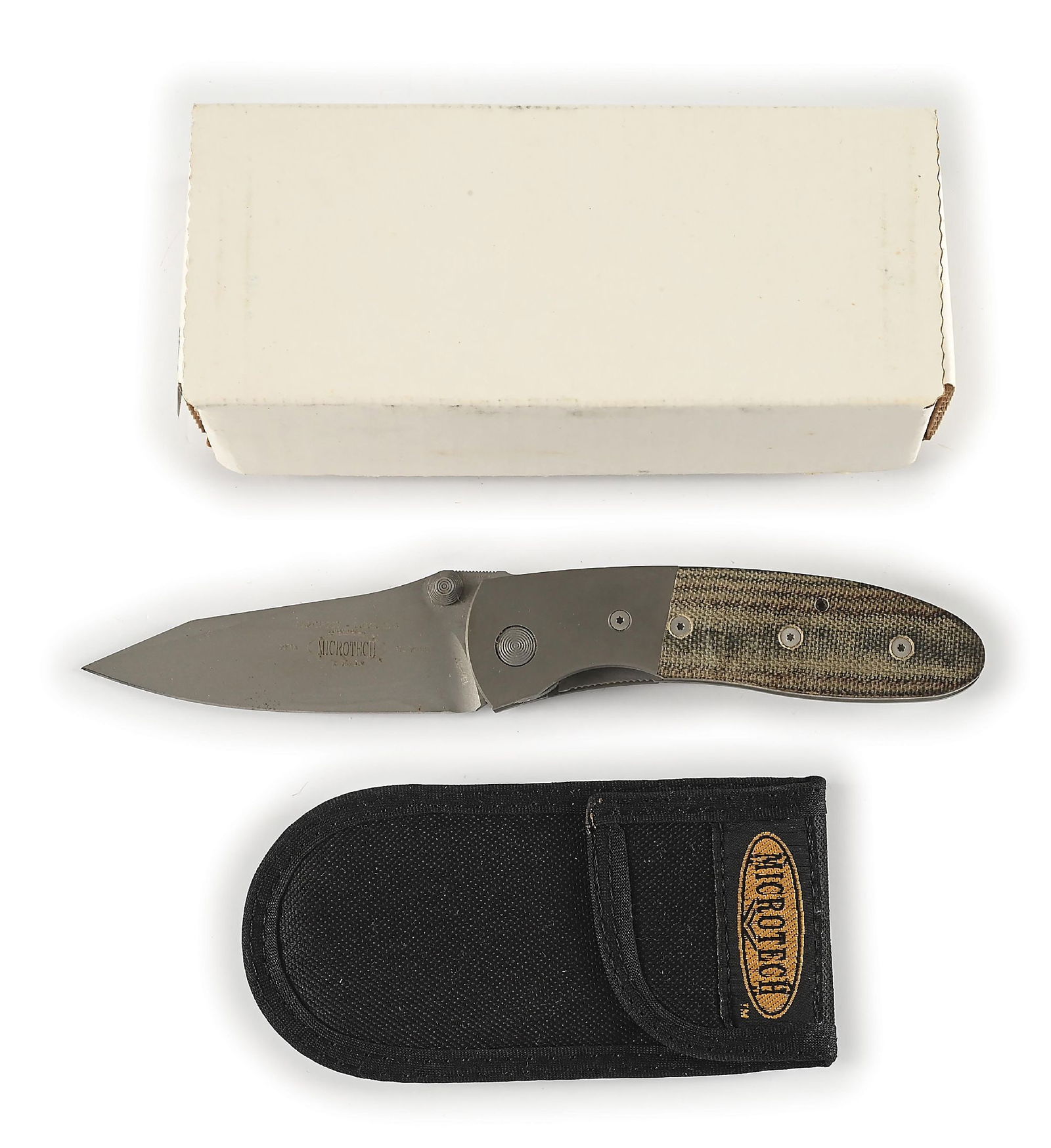 BOXED MICROTECH LIGHTFOOT.: Microtech Lightfoot LCC D/A features a bead blasted 154-CM plain blade marked "LIGHTFOOT L.C.C. D/A" with Microtech logo. Numbered "2513" and dated "12/2000". Bead blasted titanium bolsters with