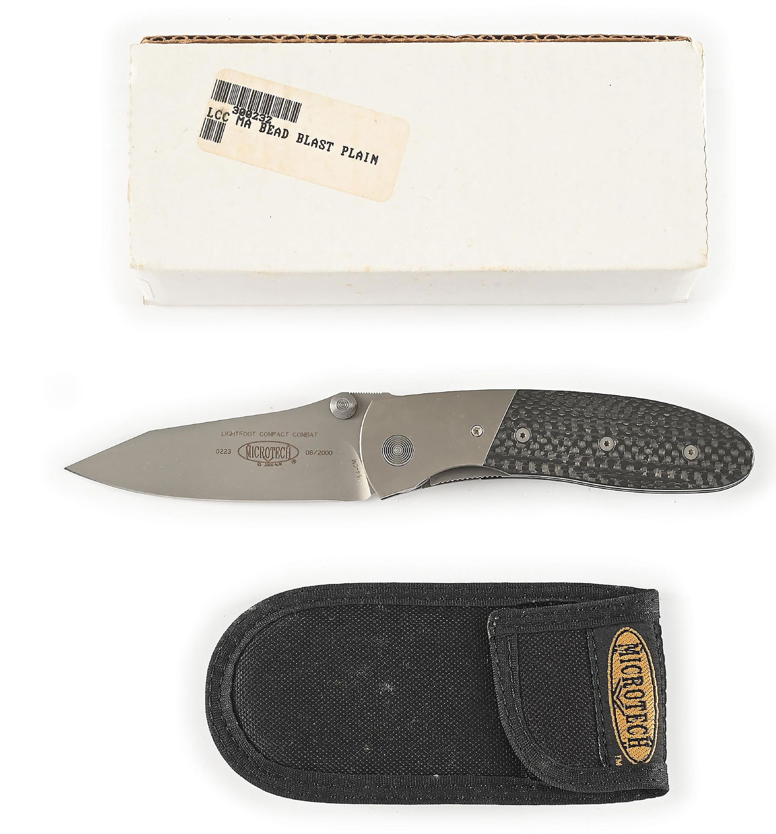 BOXED MICROTECH LIGHTFOOT.: Microtech Lightfoot LCC manual action that features a bead blasted 154-CM plain blade marked "LIGHTFOOT COMPACT COMBAT" with Microtech logo. Numbered "0223" and dated "8/2000". Bead blasted titanium