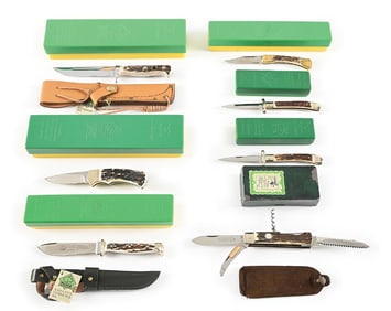 LOT OF 7: PUMA KNIVES IN GREEN AND YELLOW BOXES.