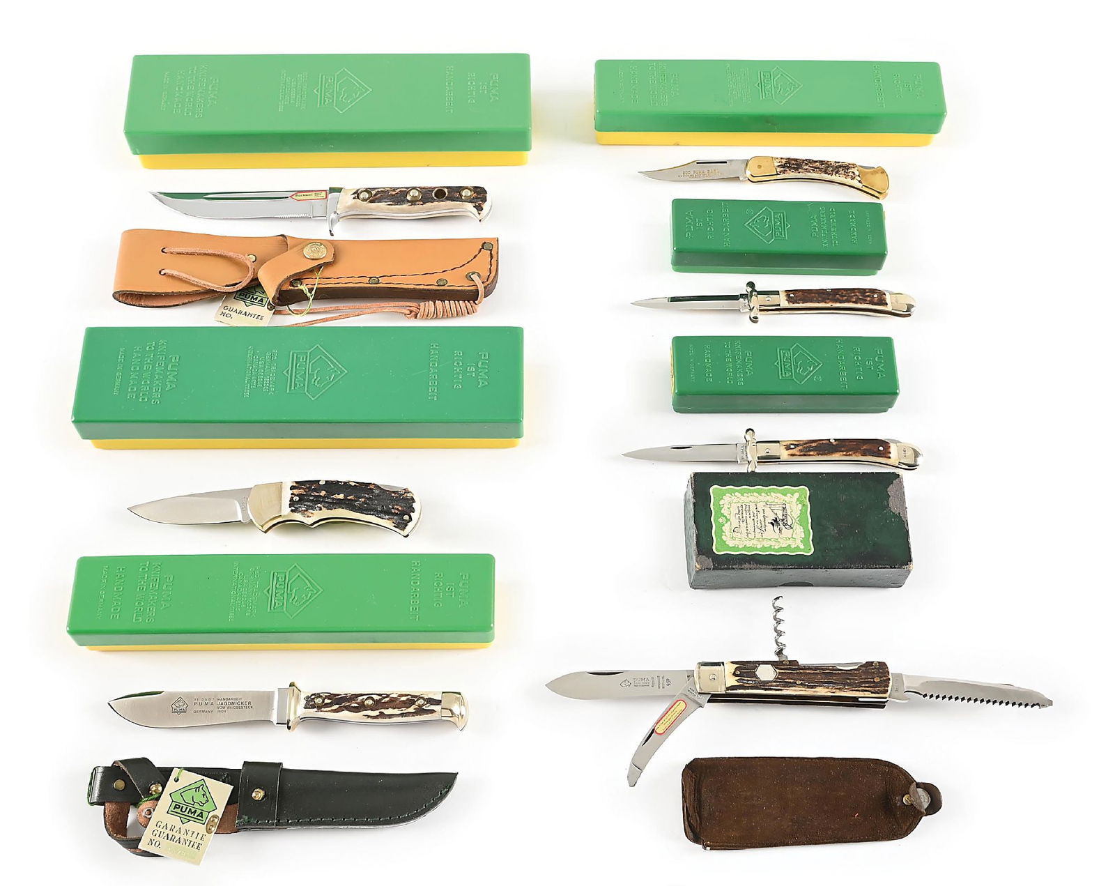 LOT OF 7: PUMA KNIVES IN GREEN AND YELLOW BOXES. (1 of 12)