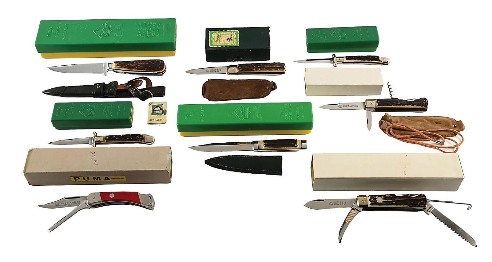 LOT OF 8: PUMA KNIVES IN GREEN AND YELLOW BOXES. (1 of 14)