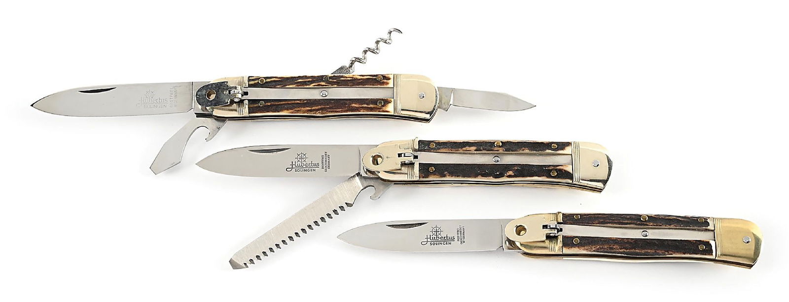 LOT OF 3: C.1970S-90S HUBERTUS STAG HANDLE LEVER LOCK SWITCHBLADES.: Lot consists of: (A) Appears unused and unsharpened. Marked “Germany”. Two blade forester with saw blade. Main blade is fully etched on obverse. Works fine. Locks open firmly. Nickel silve
