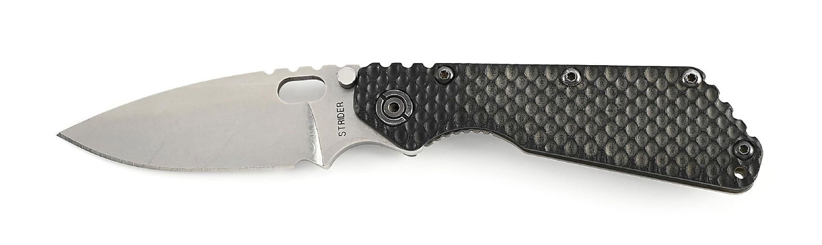 CUSTOM MICK STRIDER LARGE SMF LINER LOCK FOLDER.: Appears unused and unsharpened with some light marks on the blade. Blade is marked on obverse “STRIDER” and marked with the Strider logo on the back tang. Gunner grip G-10 handles.
