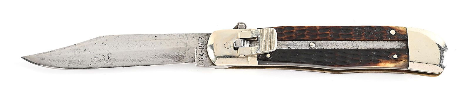 C. 1920S KA-BAR UNION CUTLERY CO. OLEAN, NY USA LEVER LOCK JIGGED BONE STAG HANDLE SWITCHBLADE.: C. 1920s. Appears unused and unsharpened. Blade is tang stamped “KA-BAR REG. U.S PAT. OFF” on obverse. Jigged bone stag handles. Works fine. Locks open firmly. Blade tip seats below the