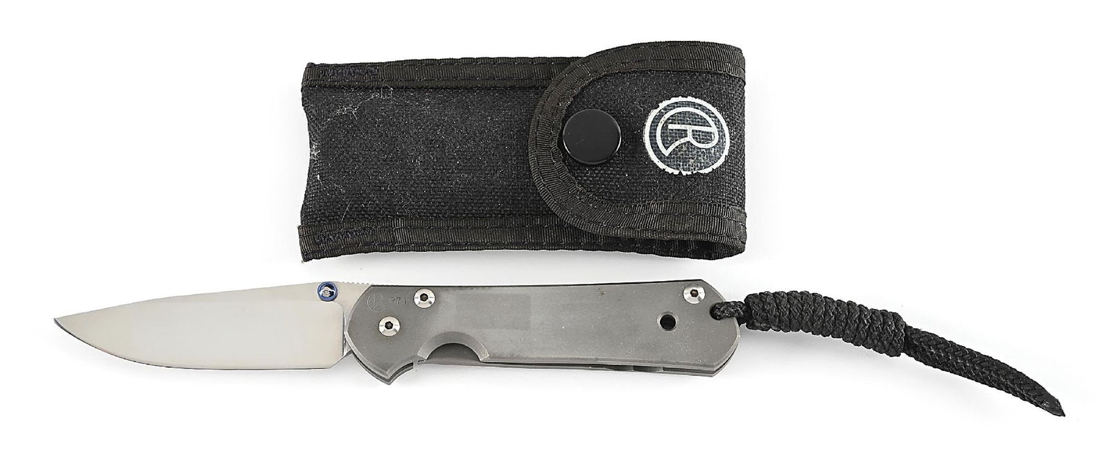 CHRIS REEVE SMALL SEBENZA.: Chris Reeve Small early 1990s original Sebenza marked “CR P 71” on obverse handle. Titanium frame and frame lock. This is an early P numbered small Sebenza. No date codes inside scales. AT