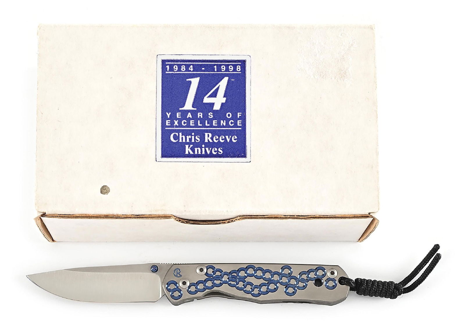 CHRIS REEVE UMFAAN FOLDING LINER LOCK KNIFE.: Features a satin finished BG42 blade with anodized titanium thumb studs and knurled thumb rest. Titanium frame is marked near the pivot screw on obverse with the “CR” logo. Obverse side is