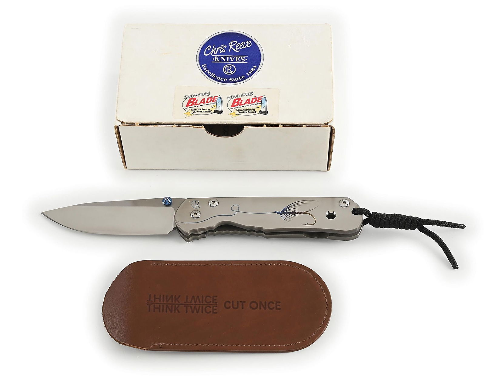 BOXED CHRIS REEVE PHEASANT TAIL LARGE SEBENZA.: Features a S30V blade with anodized titanium thumb stud and knurled thumb rest. Titanium frame is marked near the pivot screw on obverse with the “CR” logo. The presentation side of the fr