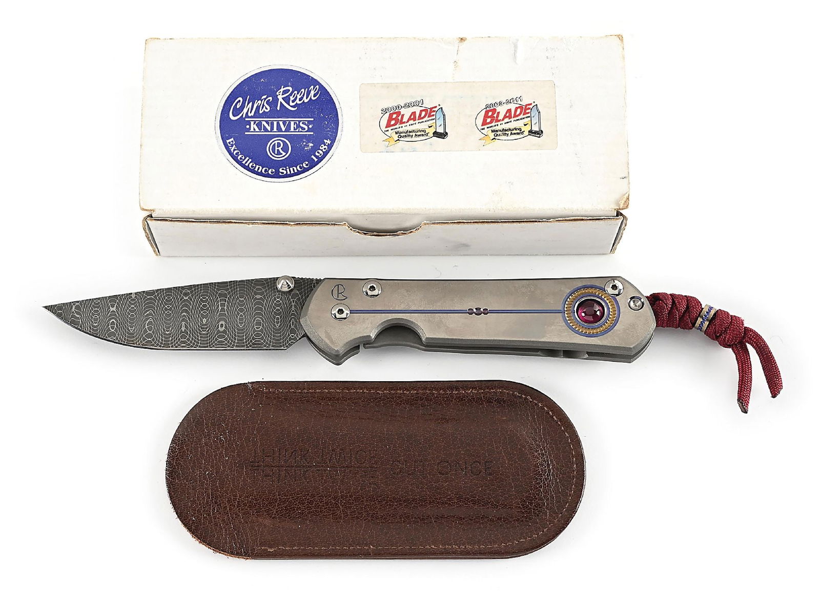 CHRIS REEVE CUTLERY UNIQUE LARGE SEBENZA FOLDING LINER LOCK KNIFE.: Features a Devin Thomas Damascus Stainless Steel Spirograph blade with titanium thumb stud and knurled thumb rest. Titanium frame is marked near the pivot screw on obverse with the “CR” lo