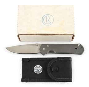 BOXED CHRIS REEVE LARGE SEBENZA "P" FOLDING KNIFE.