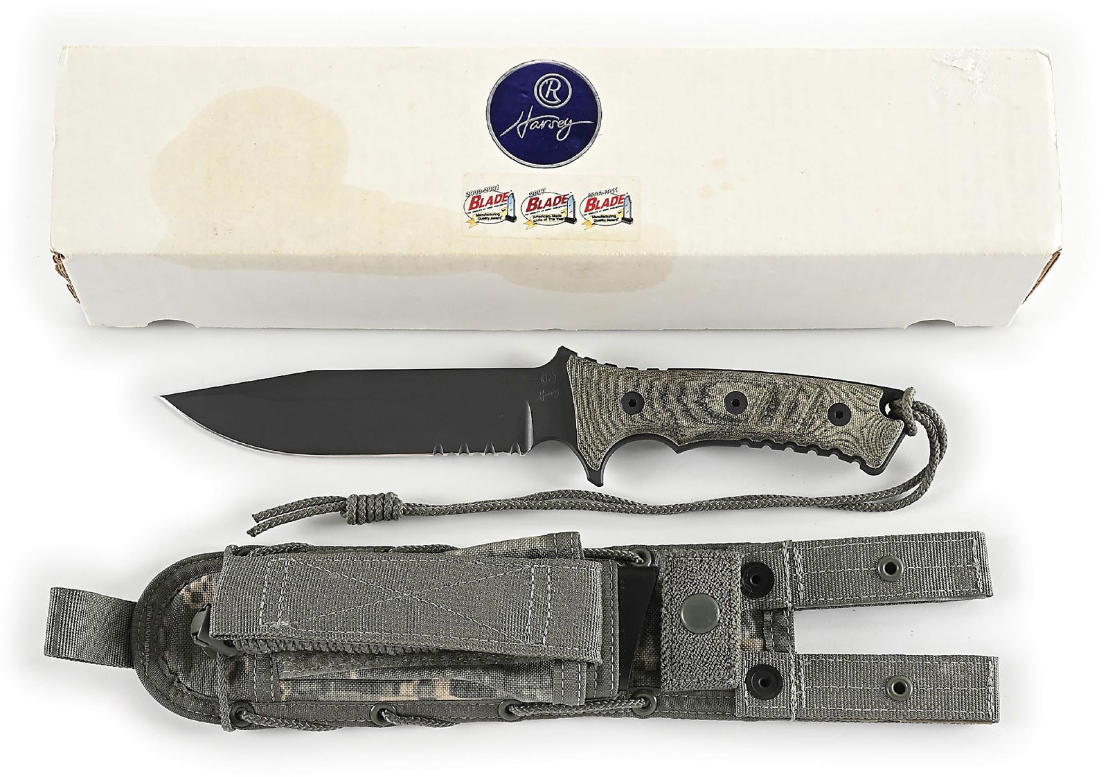 BOXED CHRIS REEVE PACIFIC.: Features a flat dark earth S35VN clip point blade with optional double row of serrations. Blade is marked "CR" and "Harvey" on obverse ricasso and "IDAHO MADE" on reverse ricasso. Durable, textured,
